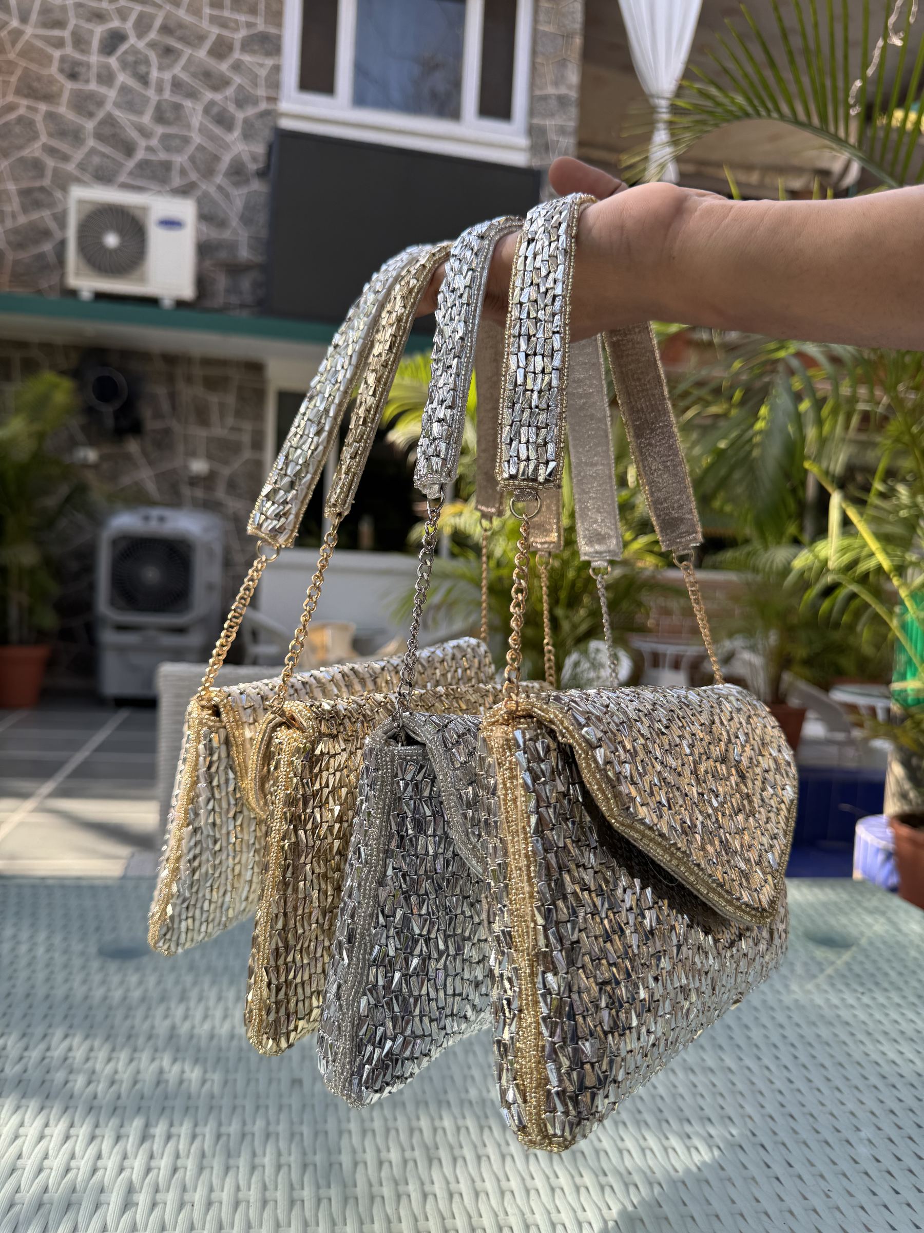 Side panel view of the Saanjh bag displaying the unique half-chain belt connection.