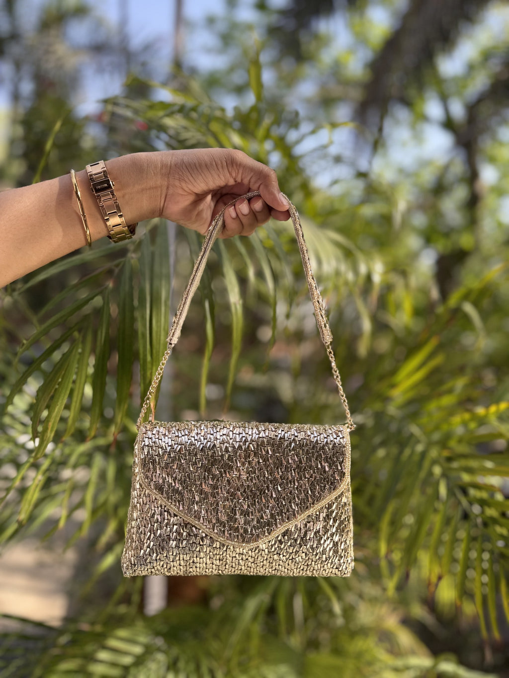 Top view of the Saanjh clutch highlighting the metal frame clasp.