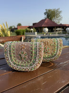 Detailed close-up of the beaded handle and the subtle fabric weave.