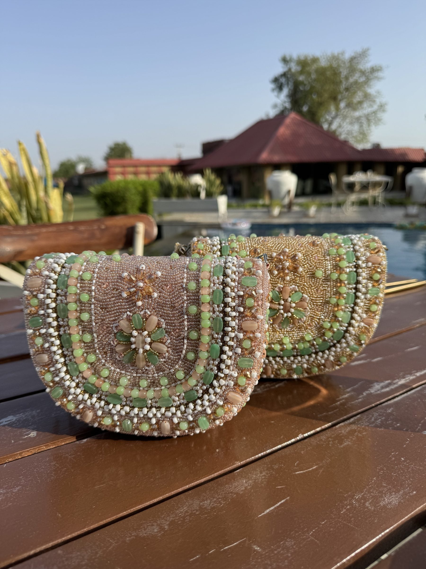 Detailed close-up of the beaded handle and the subtle fabric weave.