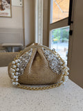 Side panel view of the Sands & Pearls bag showing its structured width.