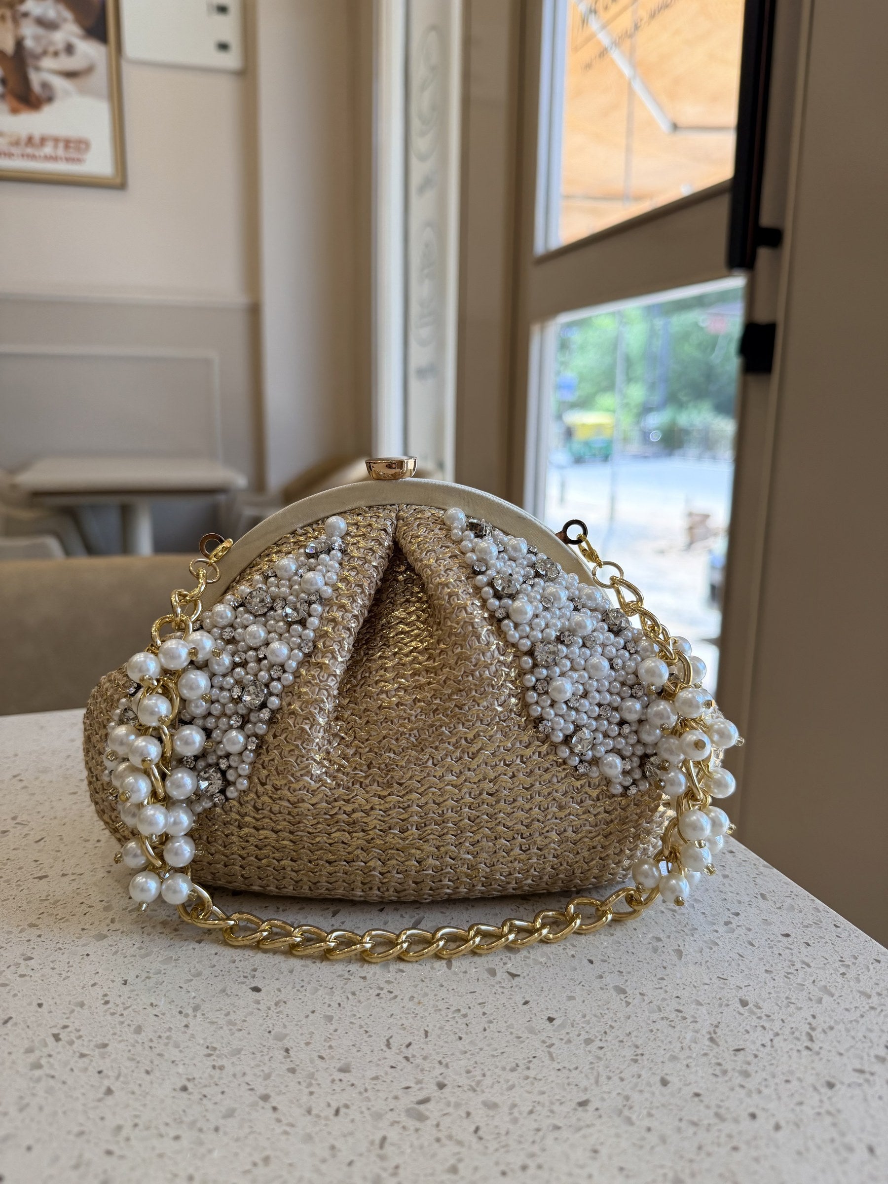 Side panel view of the Sands & Pearls bag showing its structured width.