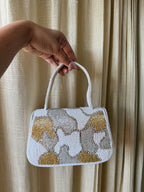 Side panel view of the Sera bag showcasing its structured rectangular frame.