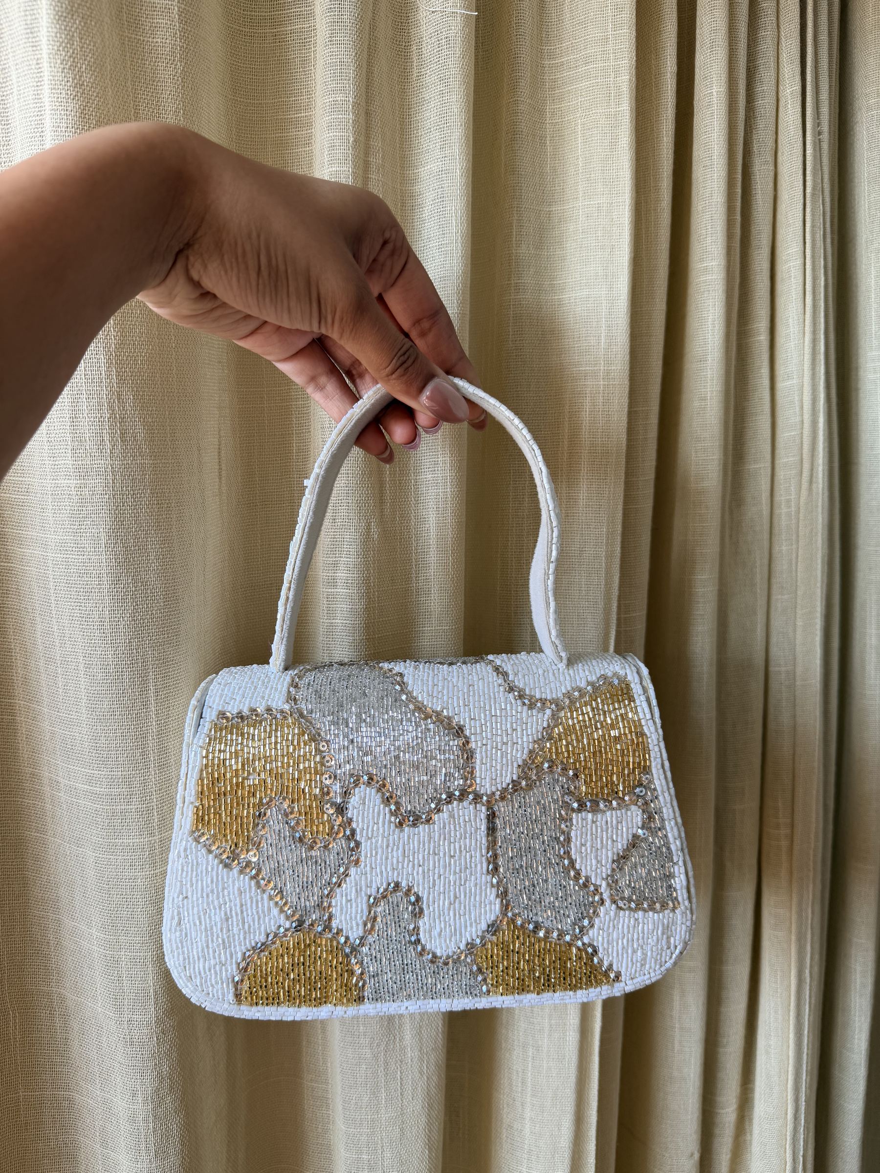 Side panel view of the Sera bag showcasing its structured rectangular frame.