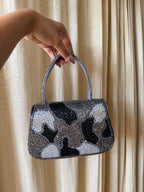 Open view of the Sera bag displaying the soft lining and spacious main compartment.