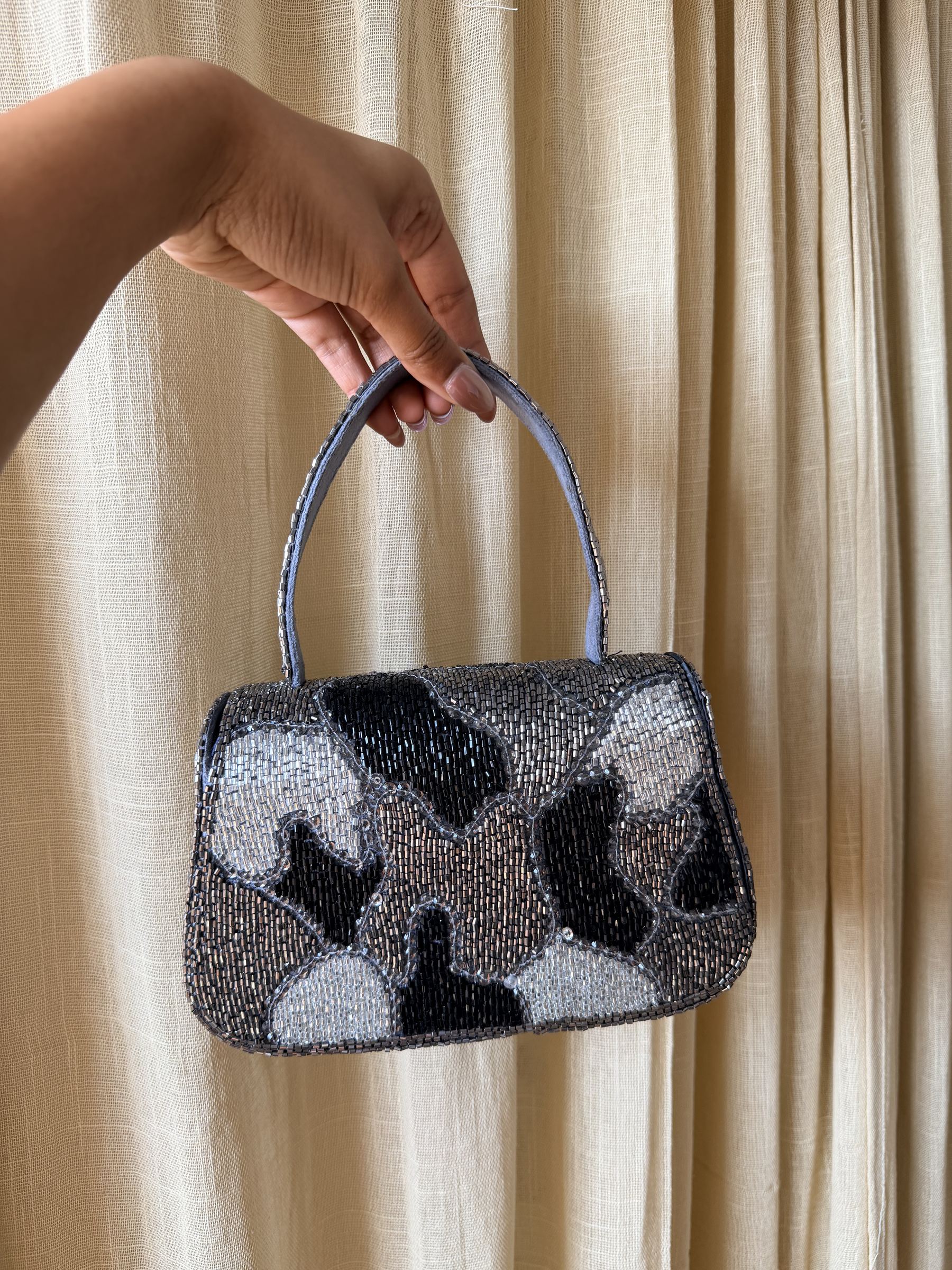 Open view of the Sera bag displaying the soft lining and spacious main compartment.