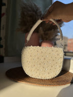 Top view of the Shukti bag highlighting the clasp closure frame.