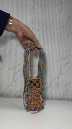 Front view of the Soul Glo Statement Bag displaying its multi-tone shimmering fabric.