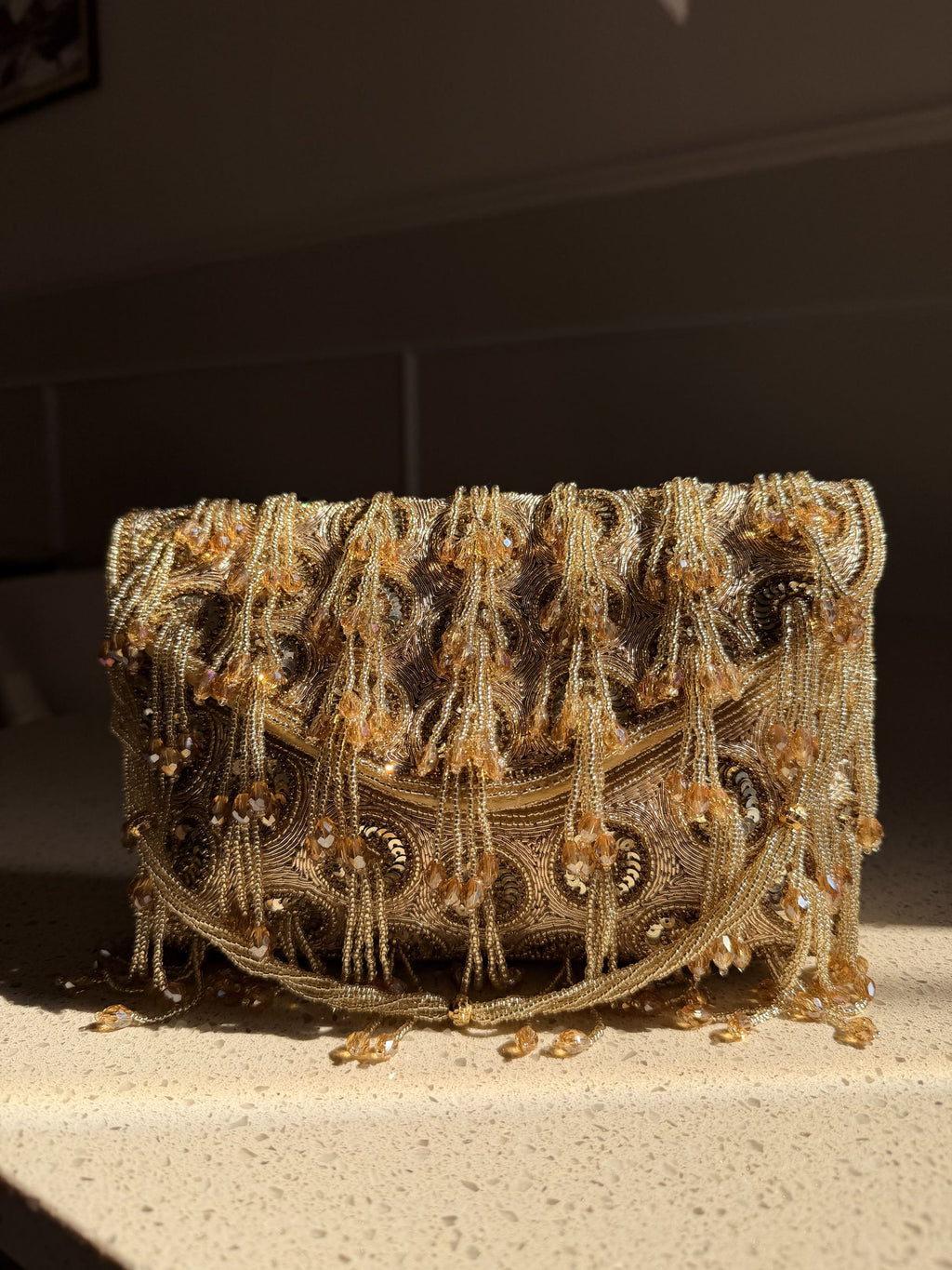 Side profile of the Starlace clutch, illustrating its structured rectangular silhouette.