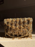 Side profile of the Starlace clutch, illustrating its structured rectangular silhouette.