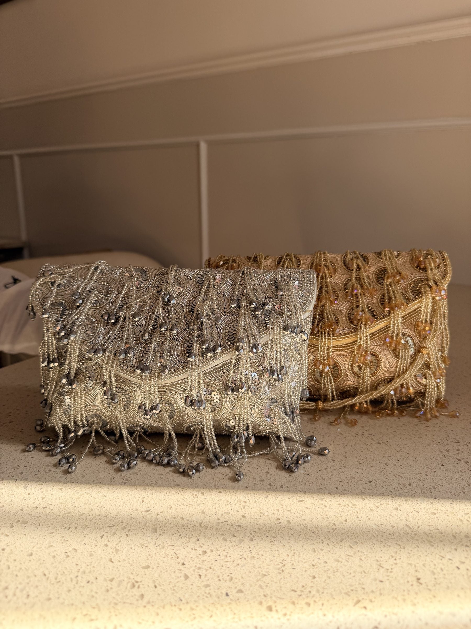 Open view of the Starlace handbag displaying its fabric lining, spacious pocket, and magnetic snap.