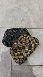 Close-up of the micro-sequins and glitter texture under warm spots.