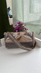 Top view of the Sunara bag highlighting the gold-tone frame clasp.