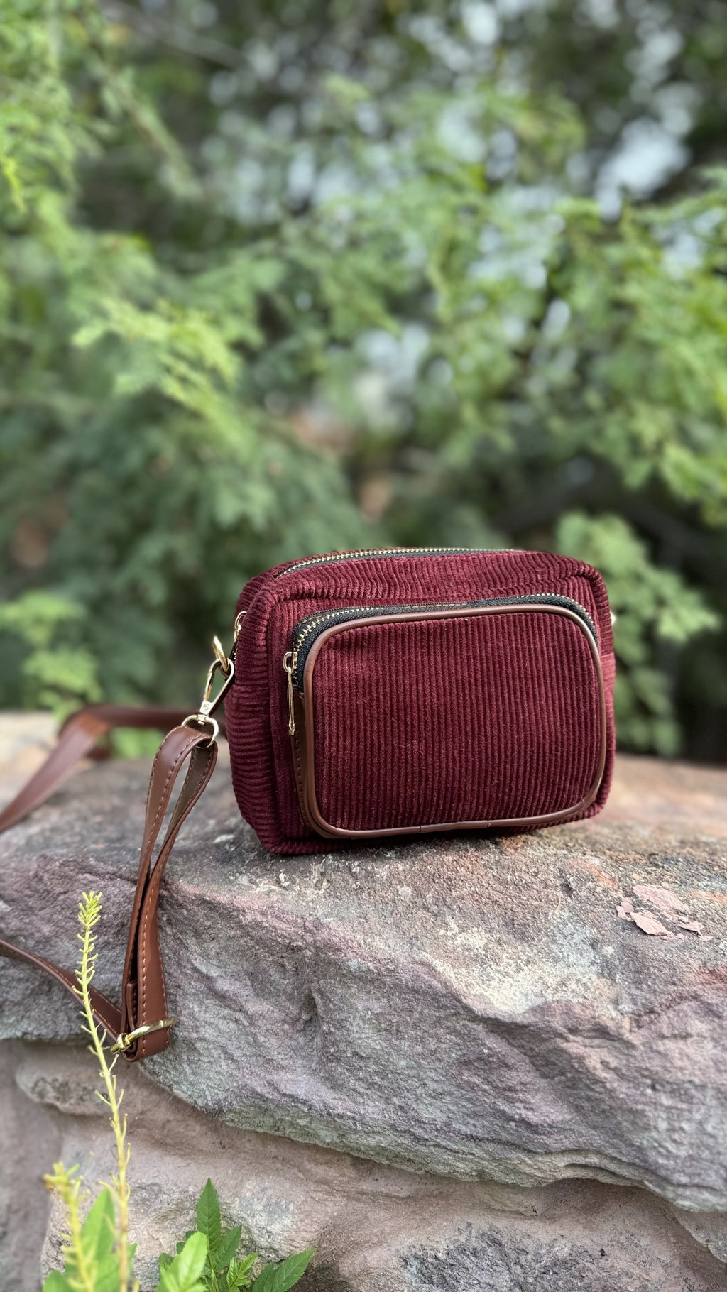 Front view of The Corduroy Edit Sling, displaying its warm camel-colored ribbed fabric and rectangular structure.