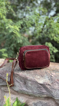Front view of The Corduroy Edit Sling, displaying its warm camel-colored ribbed fabric and rectangular structure.