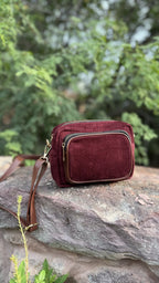 Front view of The Corduroy Edit Sling, displaying its warm camel-colored ribbed fabric and rectangular structure.