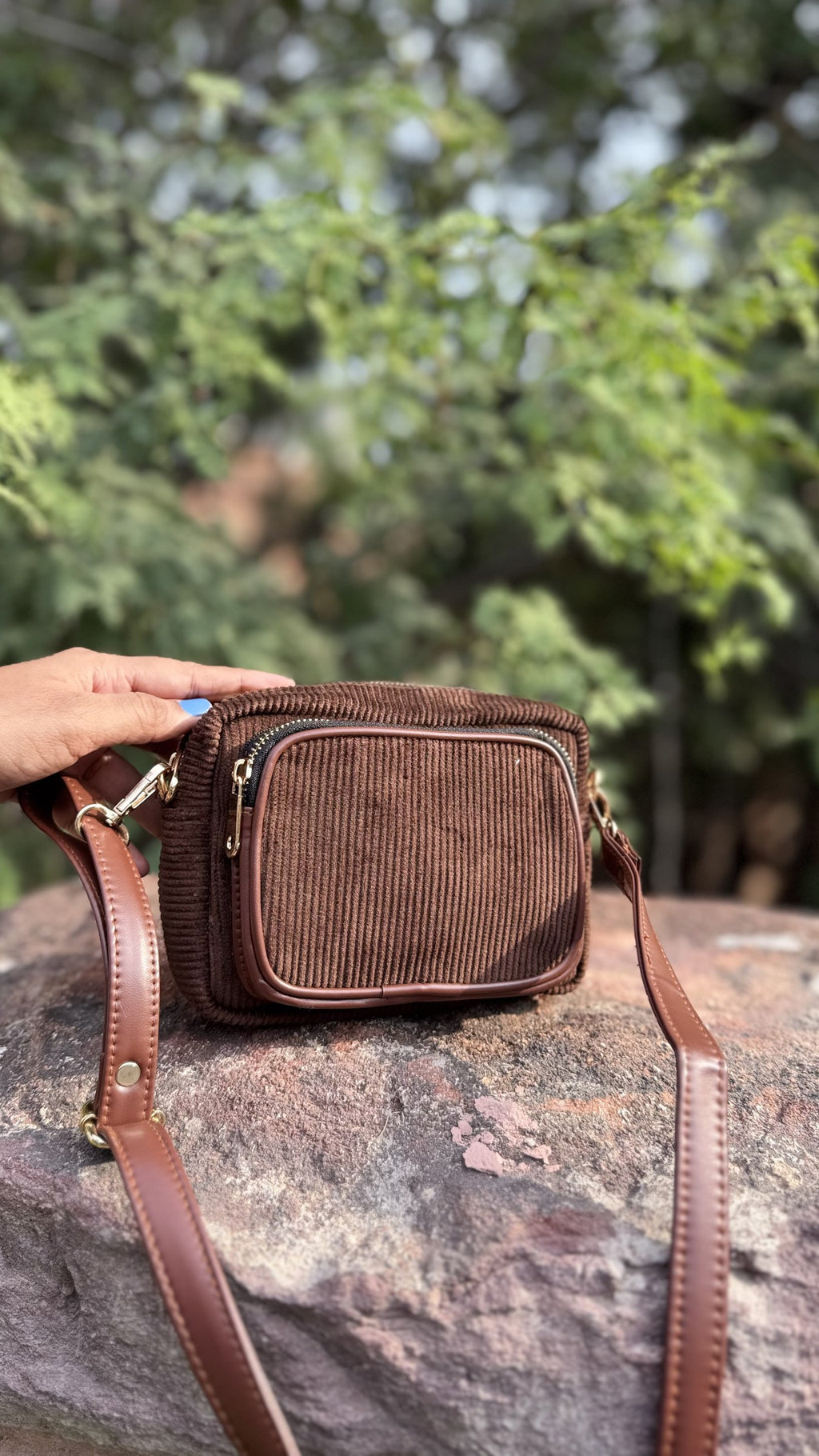 Side view showing the reinforced depth of the structured corduroy bag.