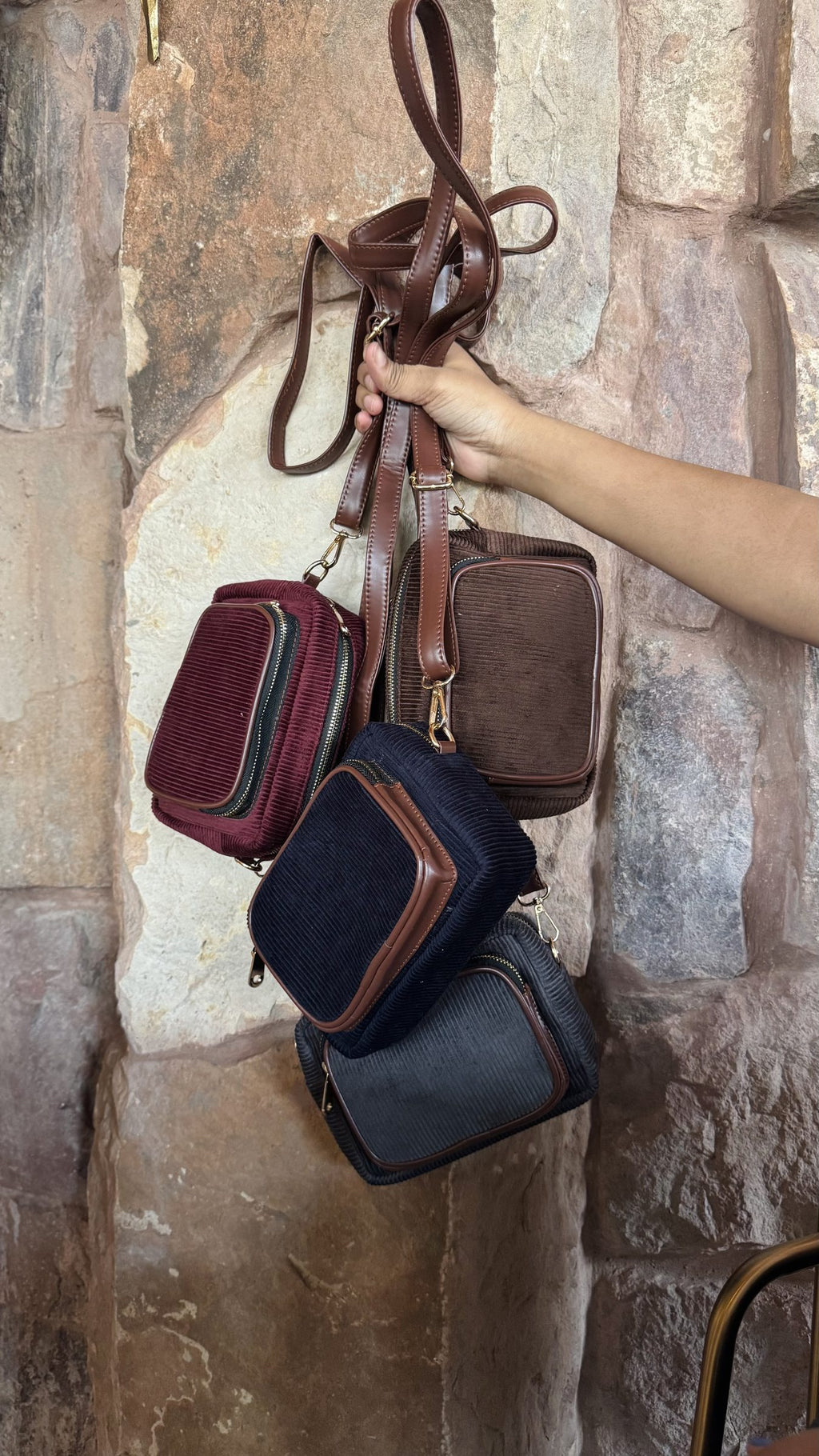 Rear panel view of the corduroy sling showcasing the neat, flat fabric alignment.