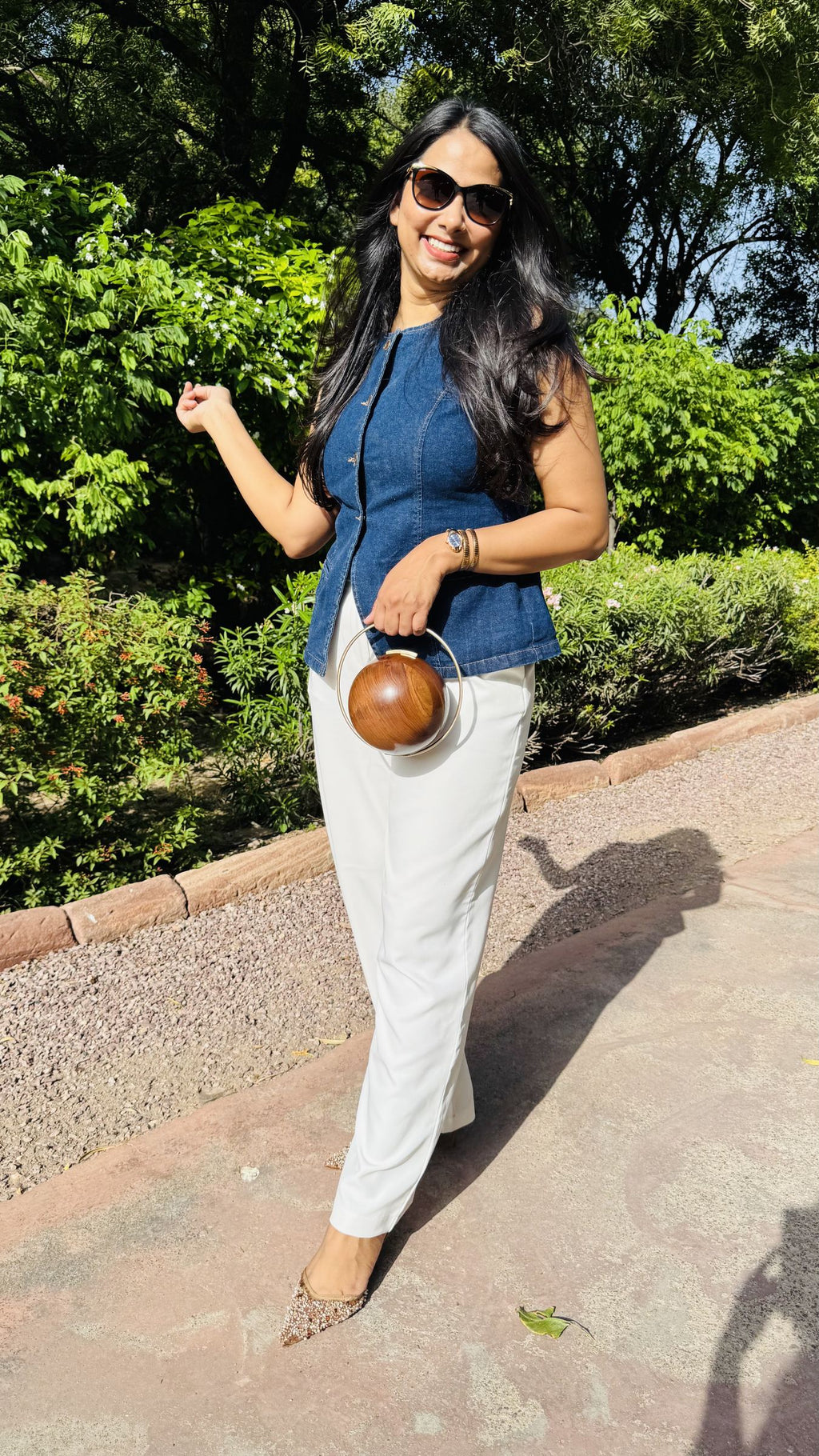 Model styling The Orb round clutch handheld for a creative statement styling.