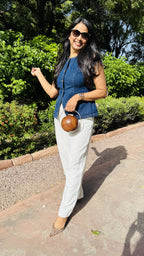 Model styling The Orb round clutch handheld for a creative statement styling.