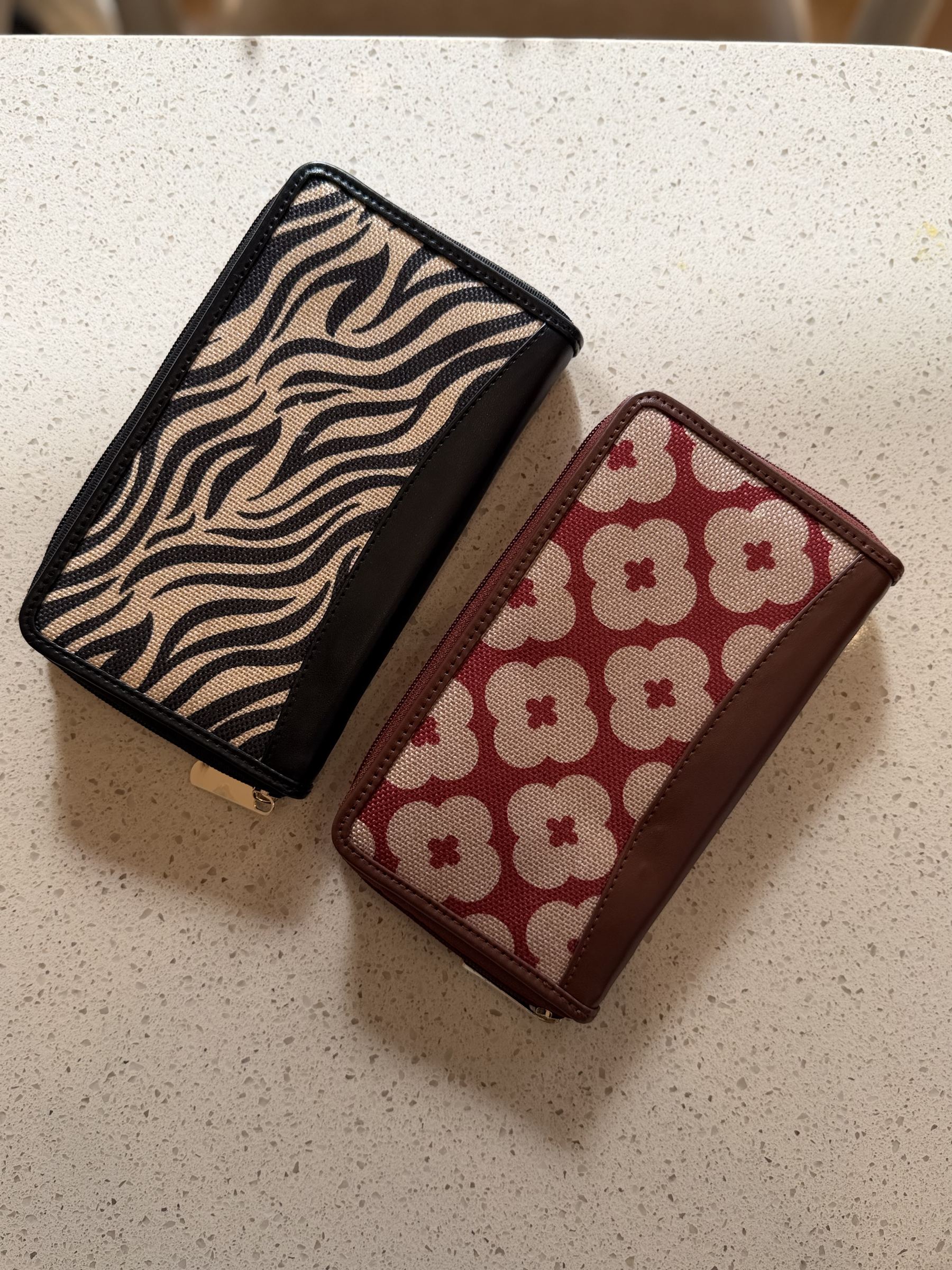 The Wallet Edit brown leather bifold wallet displaying the snap closure and structured back zip pocket.