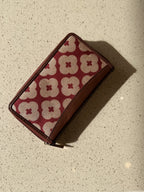 The Wallet Edit showing the coin pocket with secure closure and organized layouts.