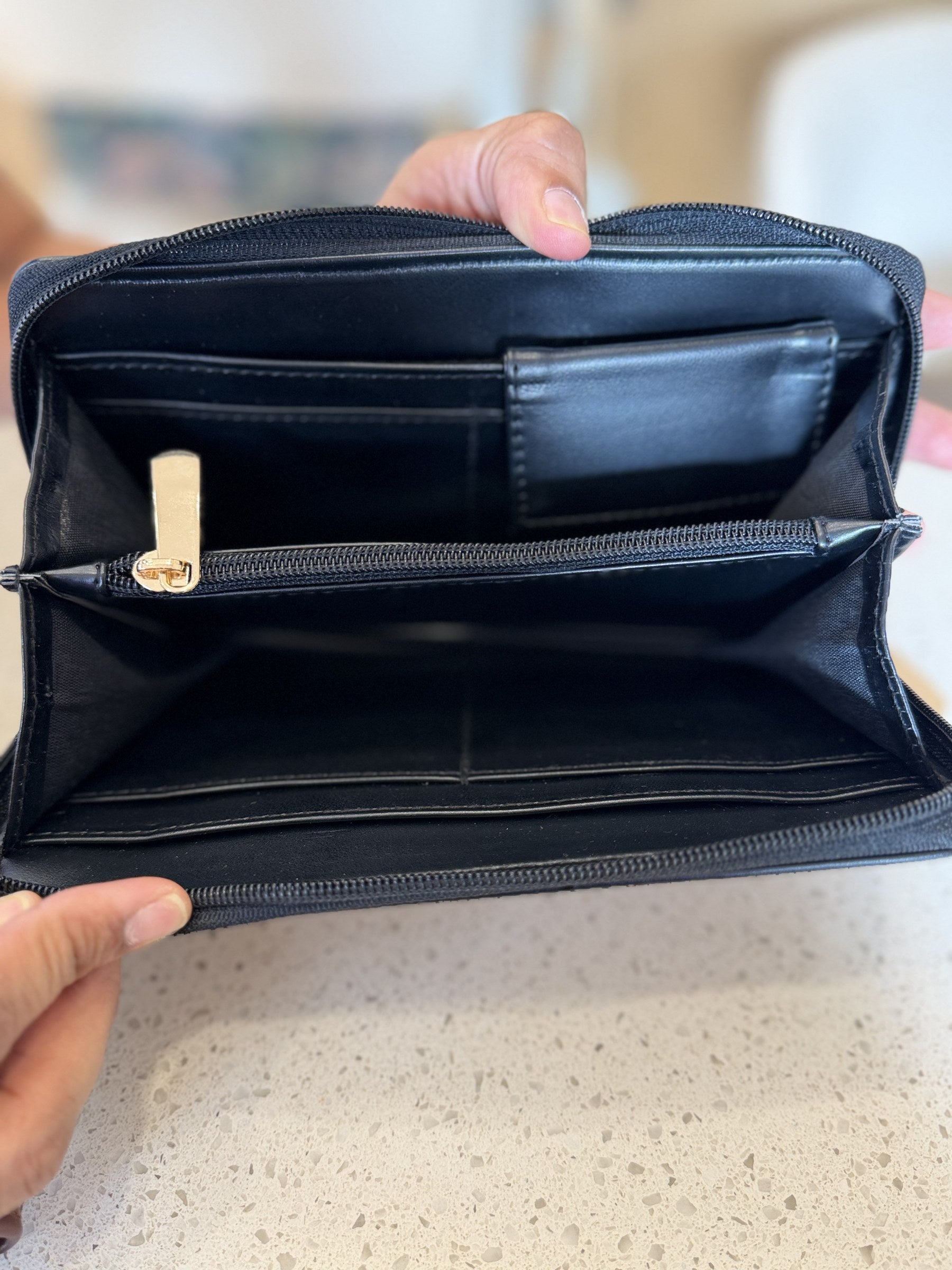 Side view showing the structured, compact thickness of the wallet when folded.