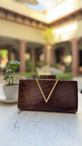Angle view showcasing the V-shaped slope and gold brass clasp.