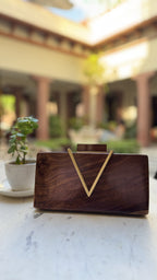 Angle view showcasing the V-shaped slope and gold brass clasp.