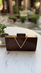 Model styling the V Wooden chevron clutch handheld with an evening dress.