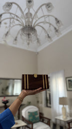 Lifestyle angle view highlighting the natural wood finish next to festive accessories.