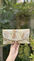 Front view of the Zaraa Blossom flap bag, showcasing its compact rectangular silhouette.