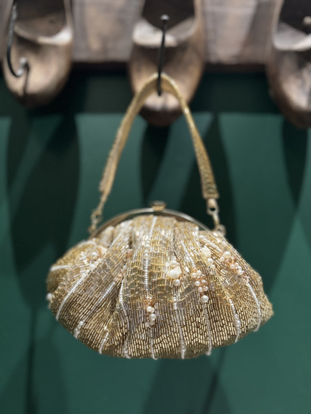 Front view of the Zari Batua, showing its gold zari thread embroidery and drawstring tassel details.