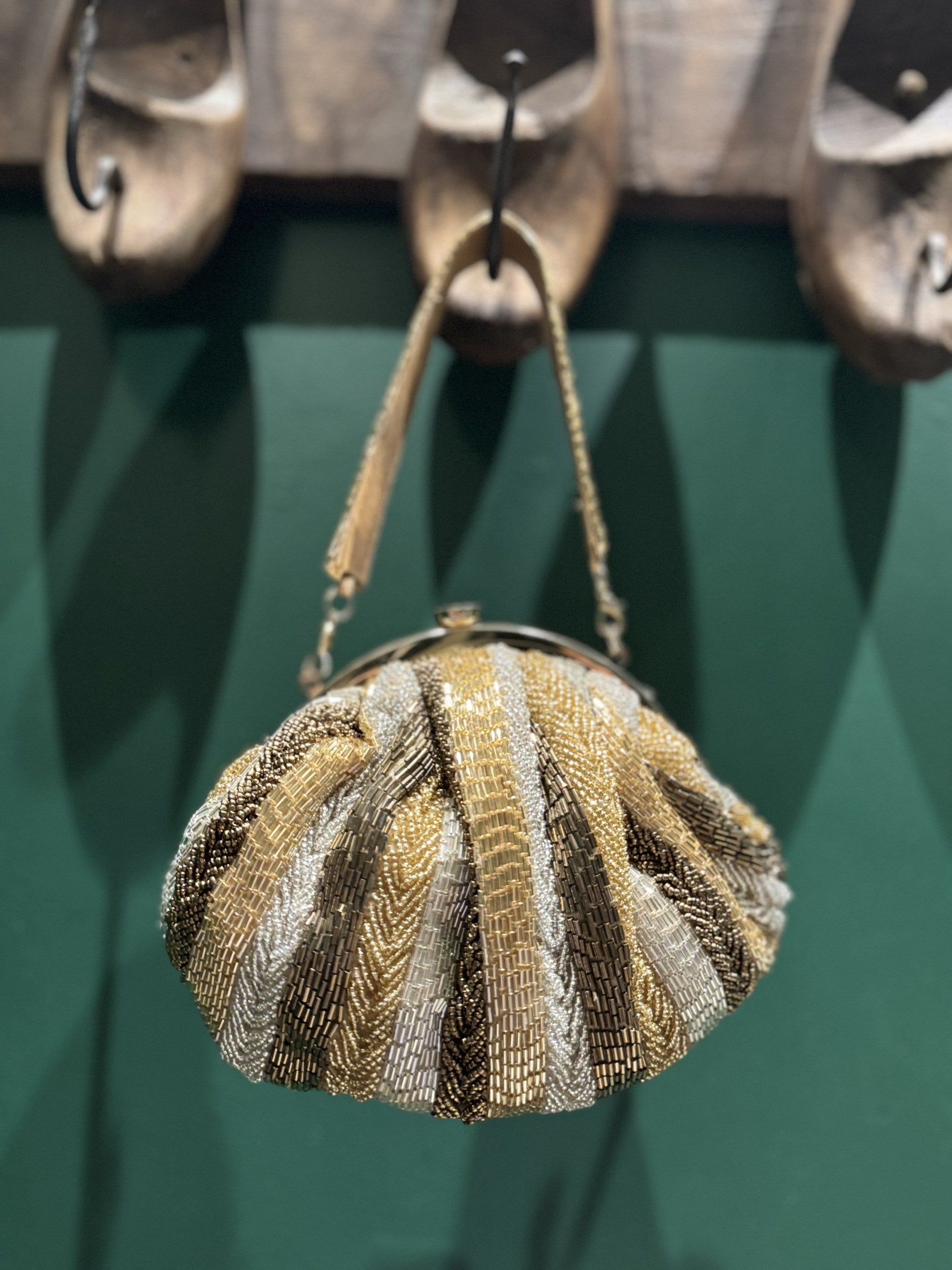 Close-up of the detailed zari threadwork, highlighting the gold and multicolor stitching.