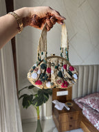 Top view of the Zari Batua highlighting the wristlet loop and drawstring opening.
