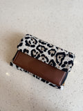 Front view of the Zinga Flap Organizer Sling closed, displaying its clean charcoal grey canvas cover.