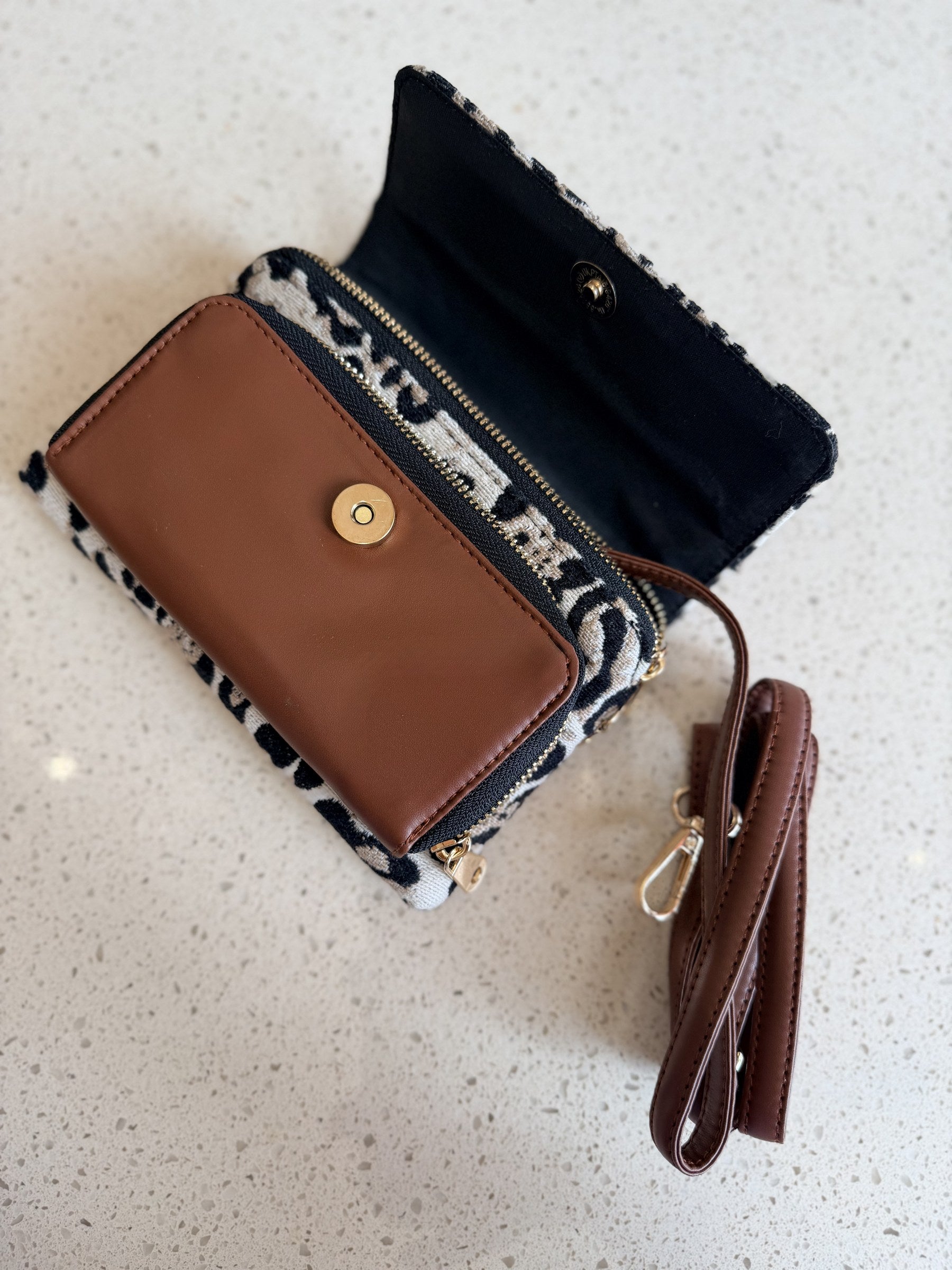 Rear perspective of the Zinga Sling highlighting the flat cross-body design and stitching.