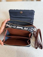 The Zinga Flap open, showing the two separate interior compartments lined in black fabric.