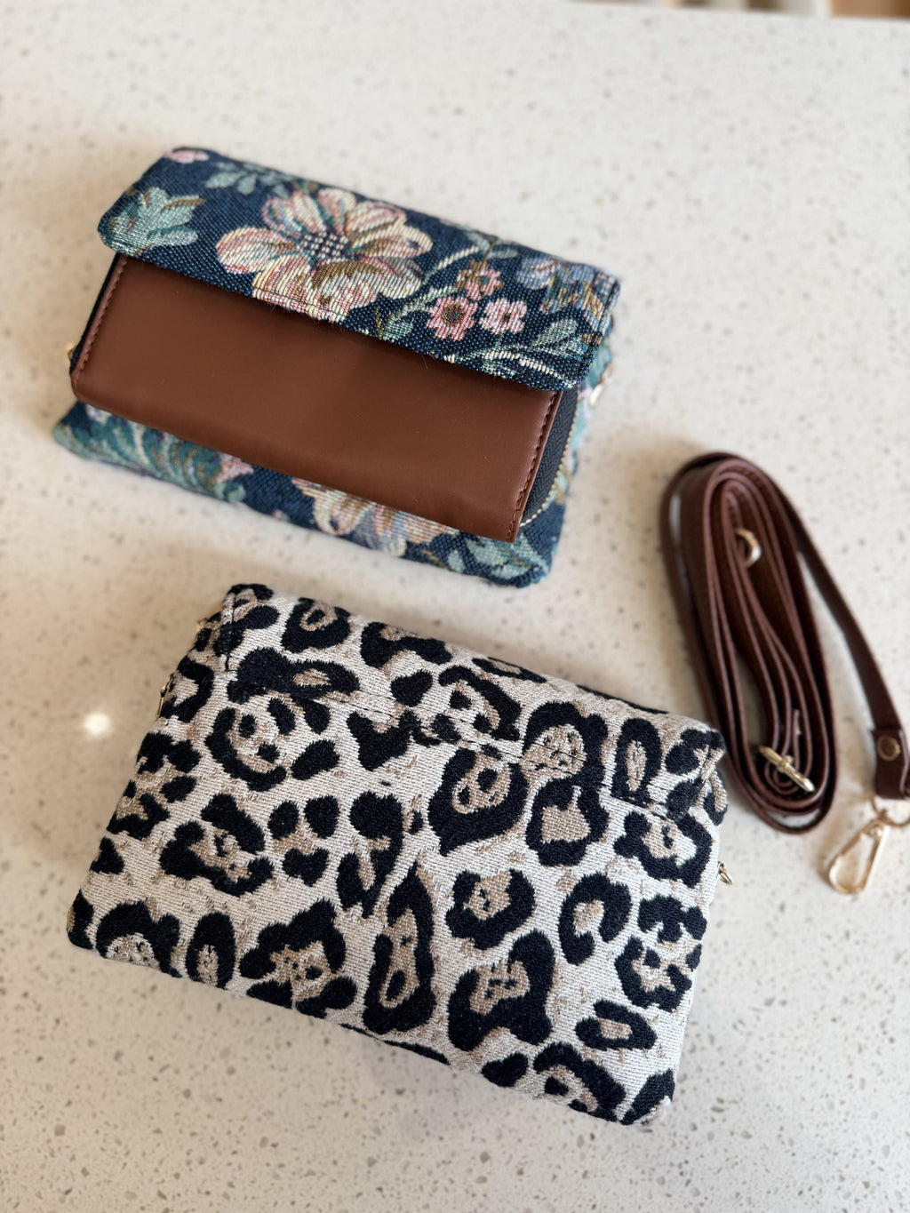 Model styling the Zinga Sling cross-body with casual office trousers and a white shirt.