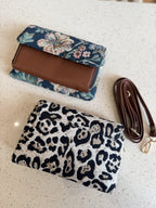 Model styling the Zinga Sling cross-body with casual office trousers and a white shirt.